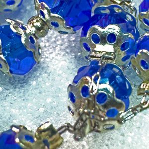 El Rosario con Piedras Azules y Metales Niquelados
